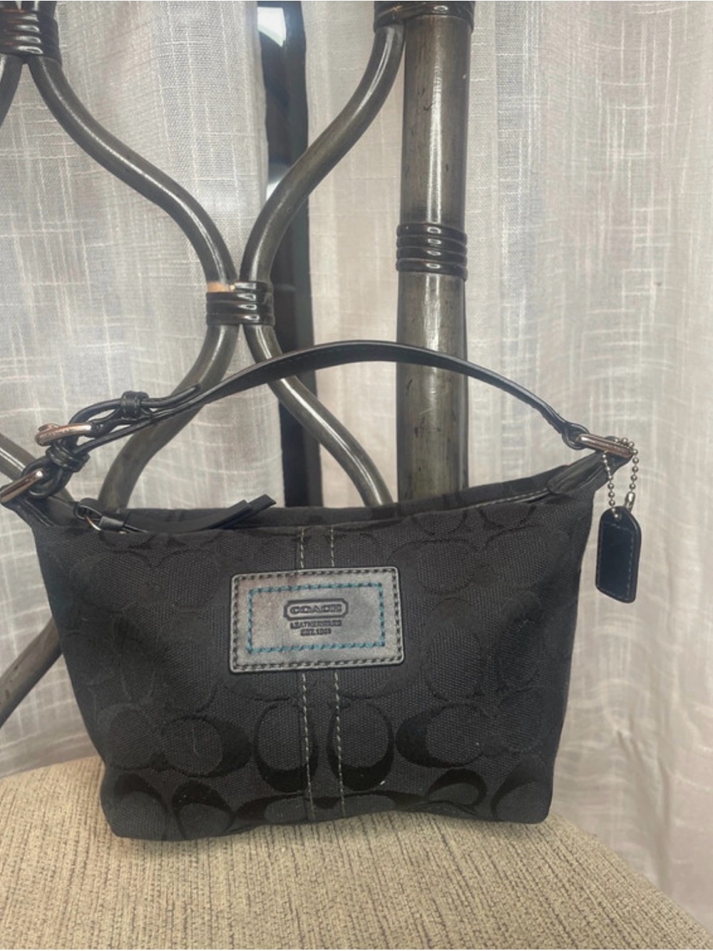 Coach Carly Mini Signature Baguette Handbag in black